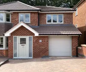 House extension with rendered finish and large glazing
